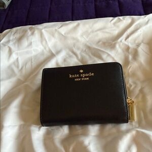 kate spade black leather zip-around wallet with gold logo
